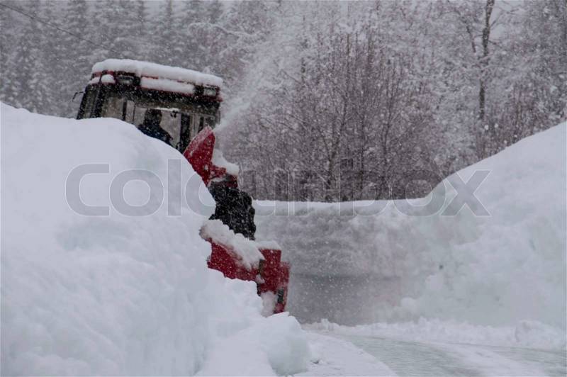 Snow plow in heavy snow, stock photo