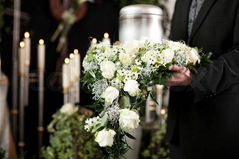 Religion, death and dolor - funeral and cemetery; urn funeral, stock photo