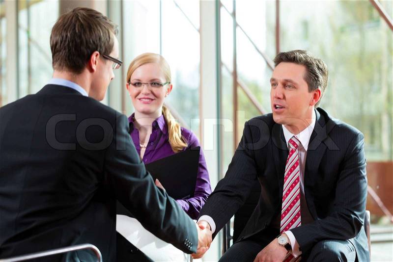 Man having an interview with manager and partner employment job candidate hiring resume CEO work business shaking hands, stock photo