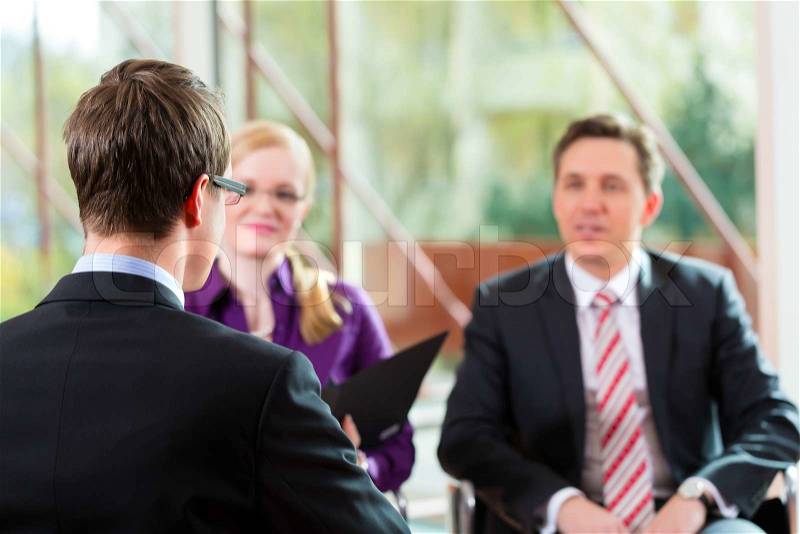 Man having an interview with manager and partner employment job candidate hiring resume CEO work business, stock photo