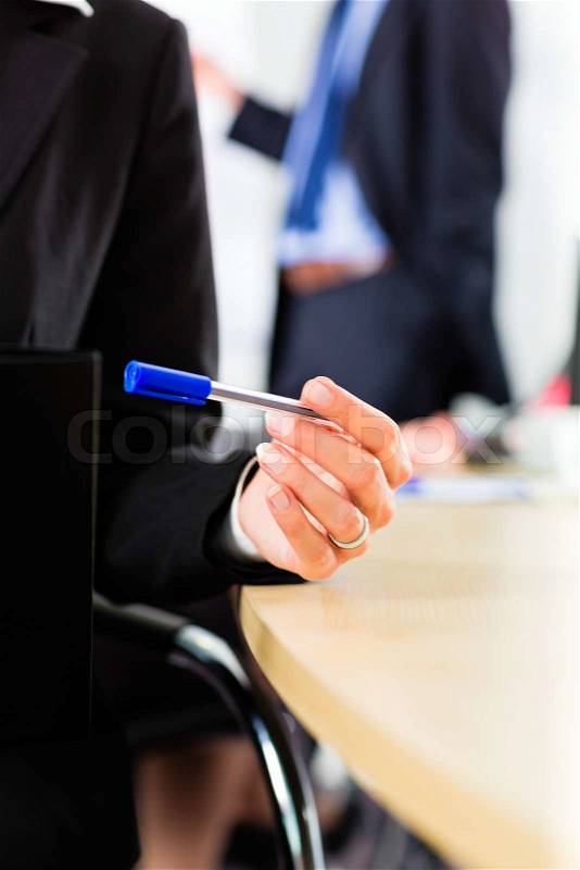 Business - businesspeople have a meeting with presentation in office, they negotiate a contract - closeup, stock photo