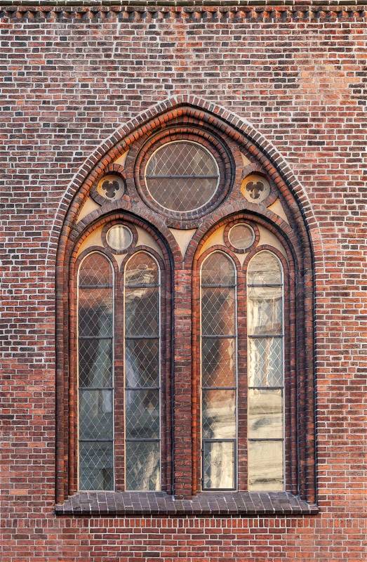 Gothic window in red brick wall of Dome Cathedral, Riga, Latvia, stock photo