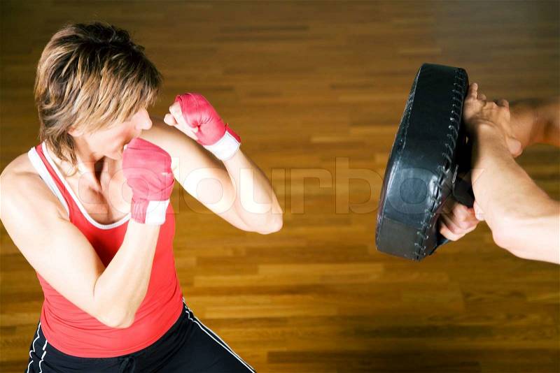 Sparring session in martial arts moves, couple exercising, stock photo