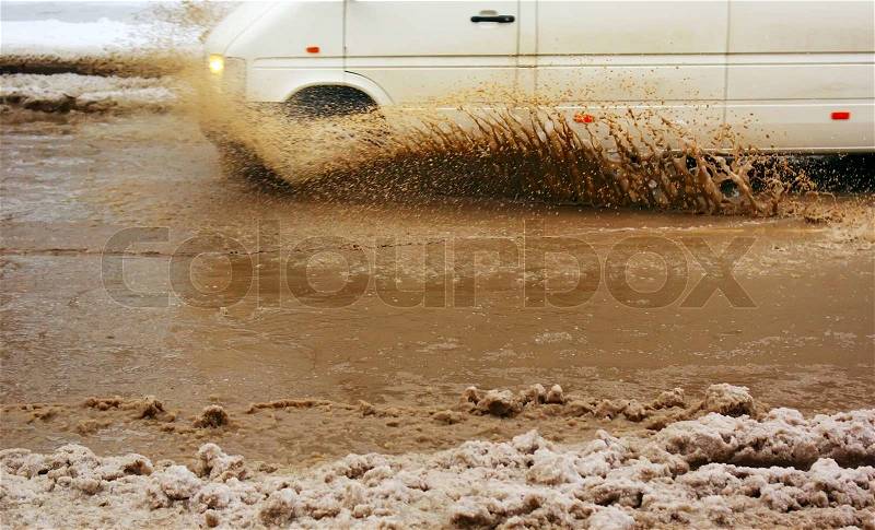 Car splash the puddle. Dynamic scene, stock photo
