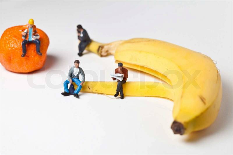 Miniature people in action in various situations, stock photo