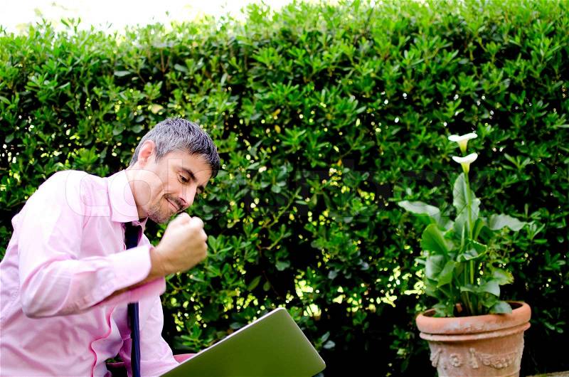 Man Working Outside Angry with his Laptop, Italy, stock photo