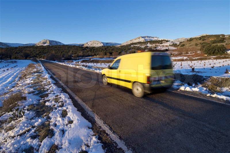 Circulating van road maintenance speeding along a straight road, Zaragoza Province, Aragon, Spain, stock photo