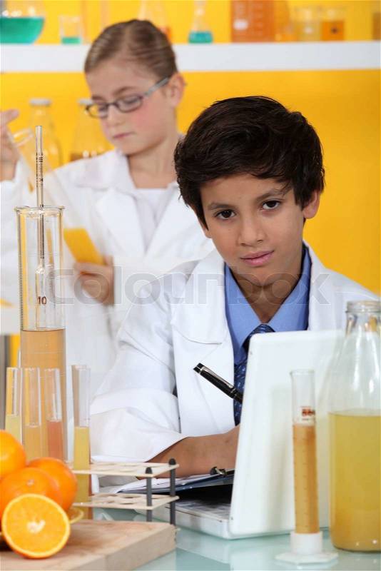 Little boy in chemistry class, stock photo