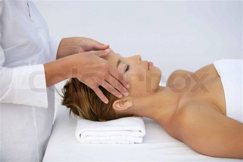 Woman being given head-massage, stock photo