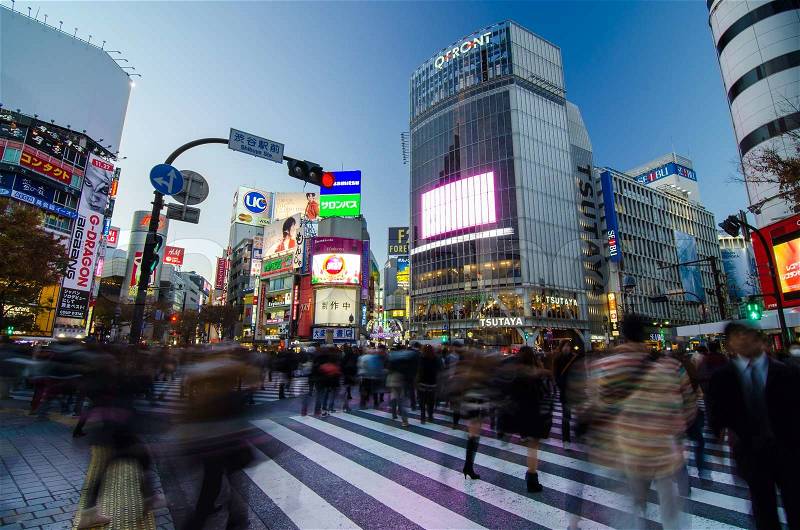 TOKYO - NOVEMBER 28: Pedestrians at the famed crossing of Shibuya district November 28, 2013 in Tokyo, Japan. Shibuya is a fashion center and nightlife area. , stock photo