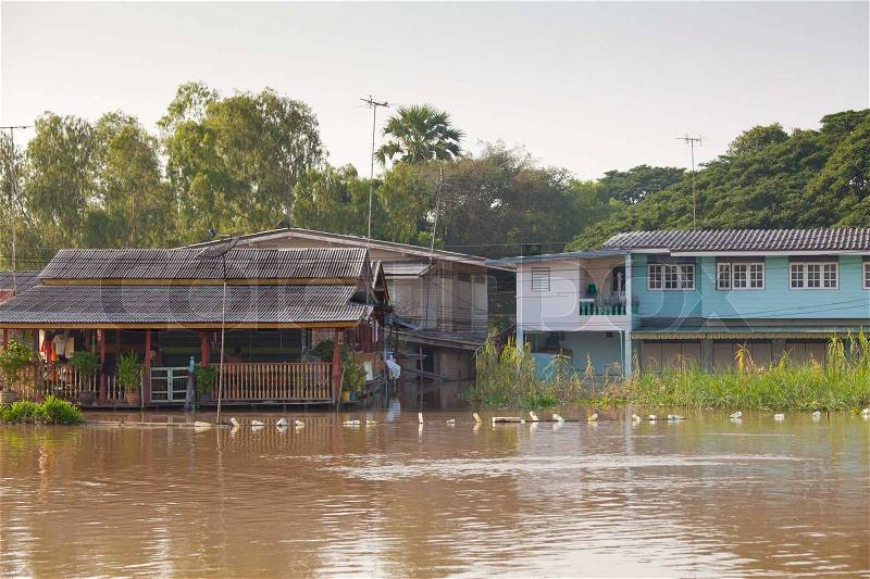 Flood waters overtake house in Thailand, stock photo