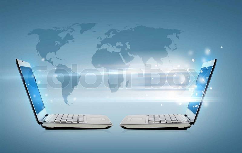Technology, internet and connection concept - two laptop computers with world map hologram, stock photo