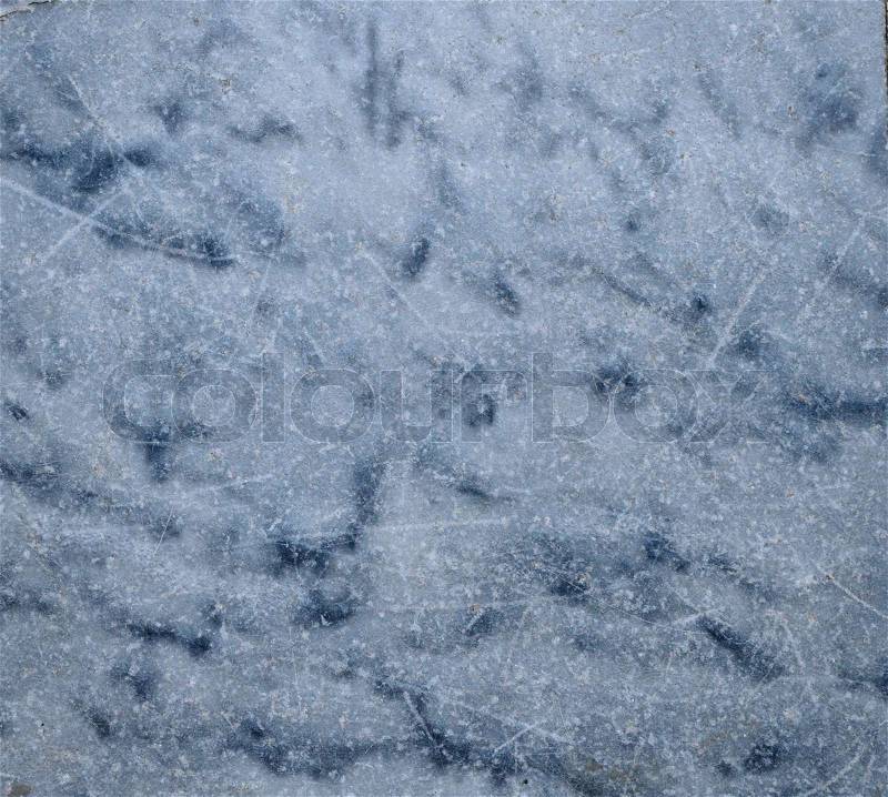 Grey-blue marble background texture of natural polished stone used in interior design and decor with light scratches on the smooth surface, stock photo