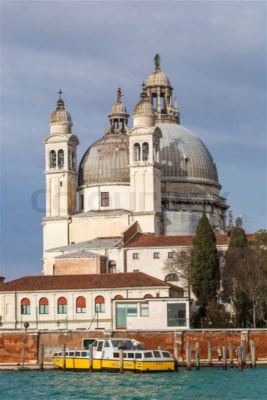 VENICE, ITALY - JUNE 6: Santa Maria della Salute church on June 6, 2013 in Venice, Italy. Venice is one of the world\'s most popular tourist destinations with 21 million visitors per annum, stock photo