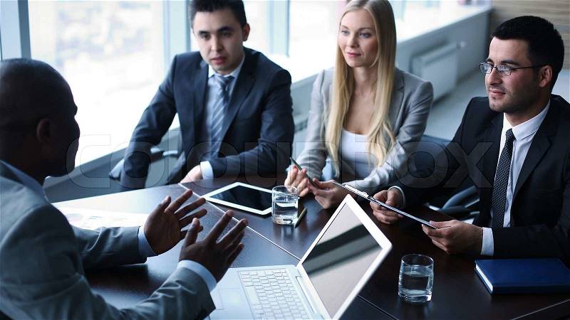 Image of business people interacting at meeting, stock photo