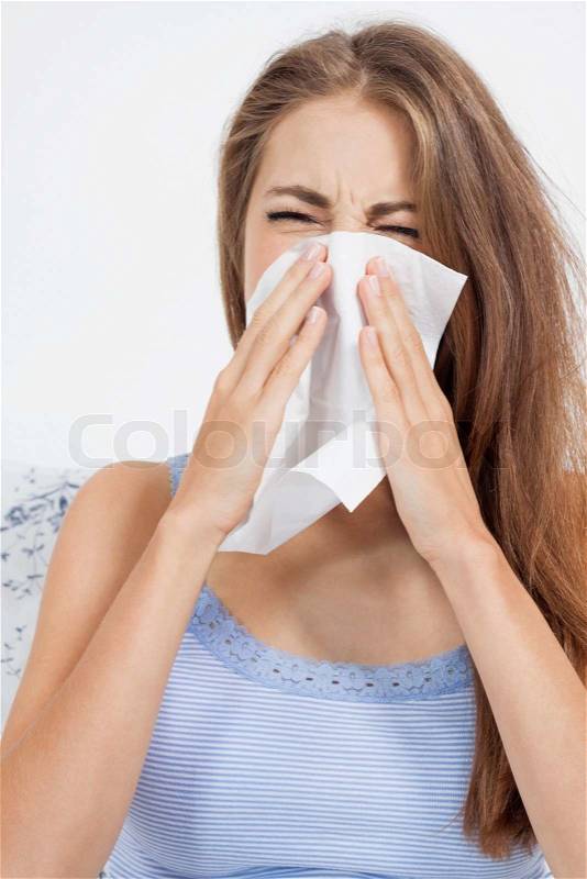 Young brunette woman with flu cold influenza portrait at home, stock photo