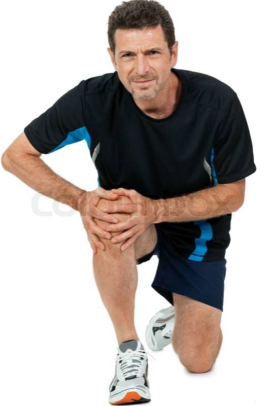 Adult attractive man in sportswear knee pain injury ache isolated on white, stock photo