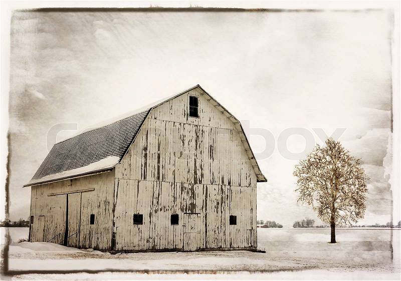 Winter snow scene with an old historic Ohio barn covered with snow. , stock photo