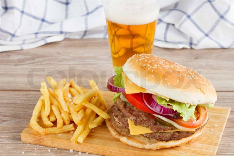 Fresh burger with french fries and beer, stock photo
