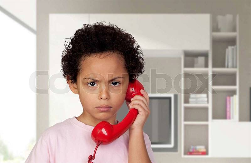 Angry latin with red phone at home, stock photo