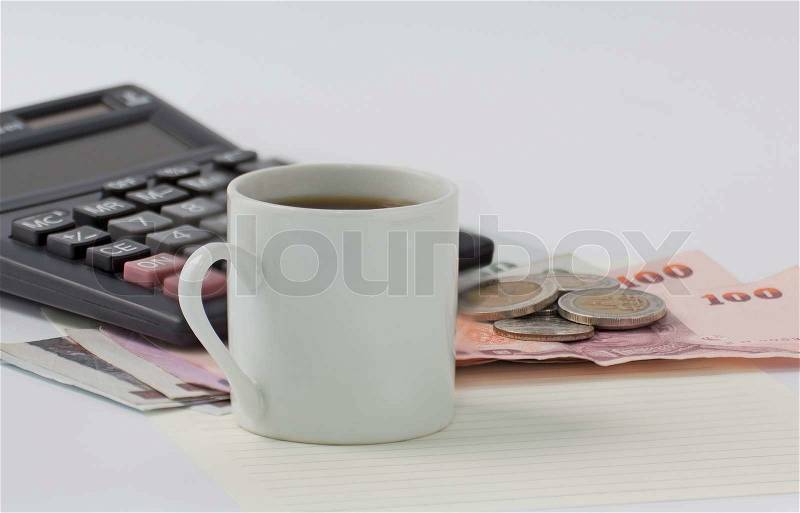 Money cash and coffee cup on table, stock photo