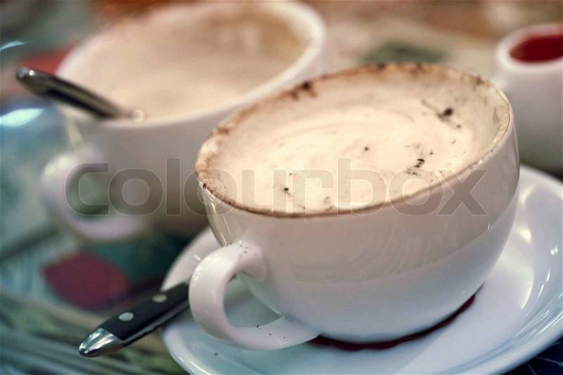 Cup of cappuccino coffee. Vintage toned photo, stock photo