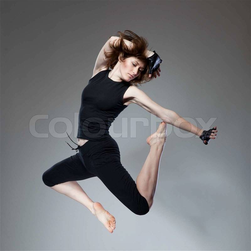 Attractive jumping woman, stock photo