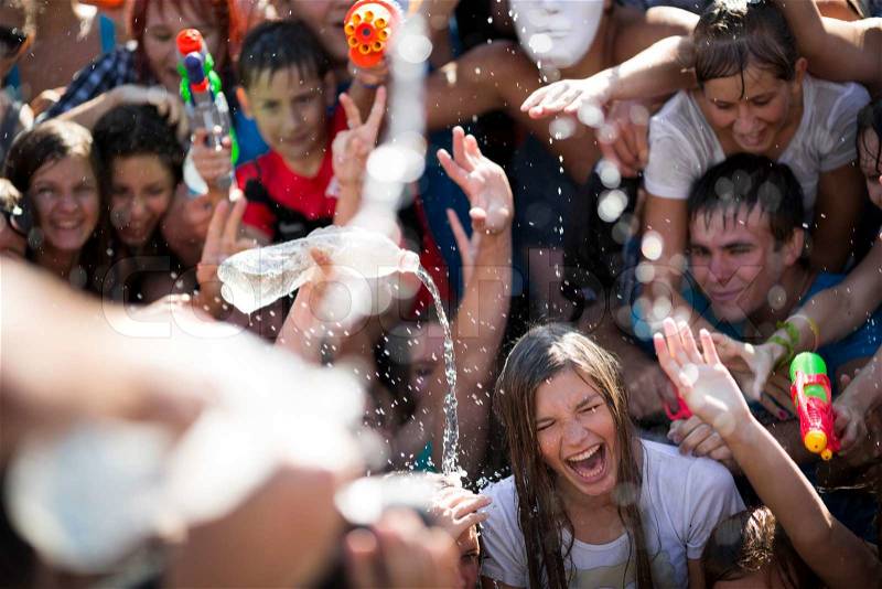 SAMARA,RUSSIA-JULY 22 2012 young people shooting and throwing water at each other during Water Wars flashmob,July 24, 2011, Samara, Russia, stock photo