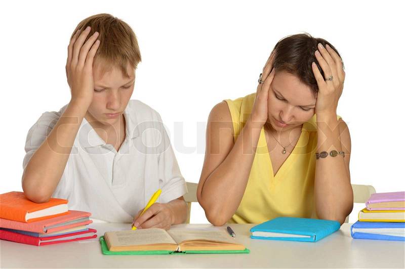 Mom and son do homework together, stock photo