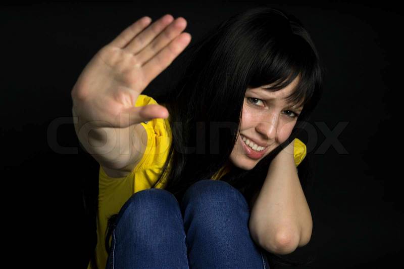 Violence, suffering girl showing stop hand, stock photo