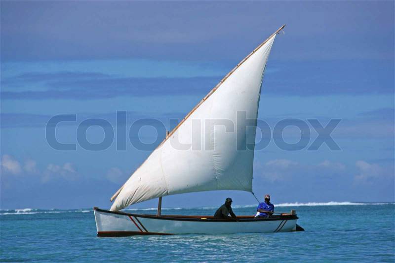 Old sailing boat wiyh two fishing men on board, they chill out after works, stock photo