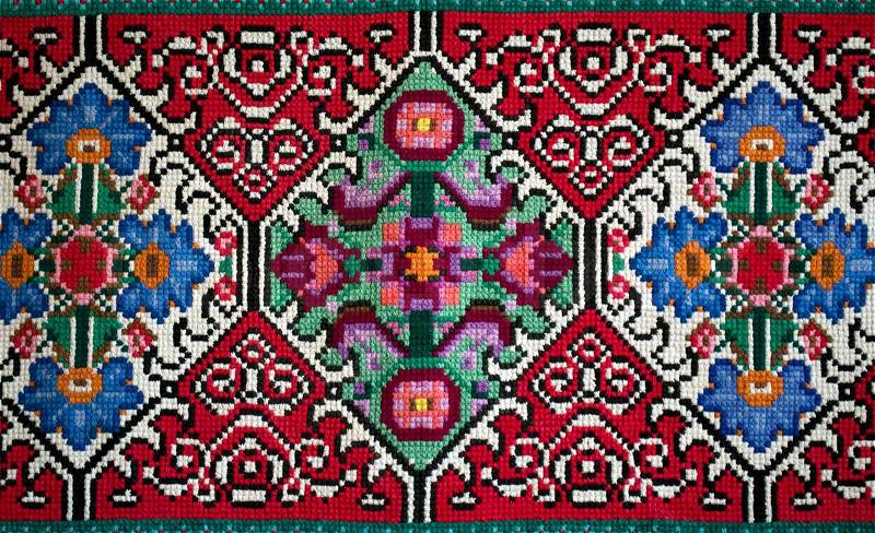 Old traditional slavic wool carpet with ancient motif, stock photo