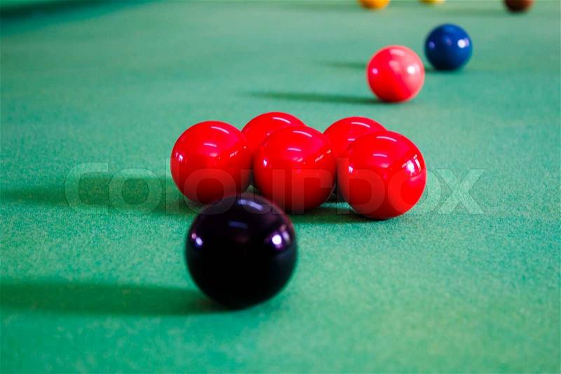 Colorful of snooker balls on green pool table, stock photo
