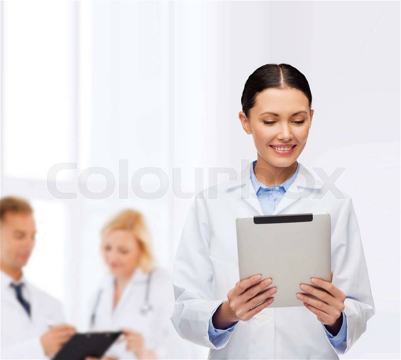 Healthcare, technology and medicine concept - smiling female doctor and tablet pc computer, stock photo