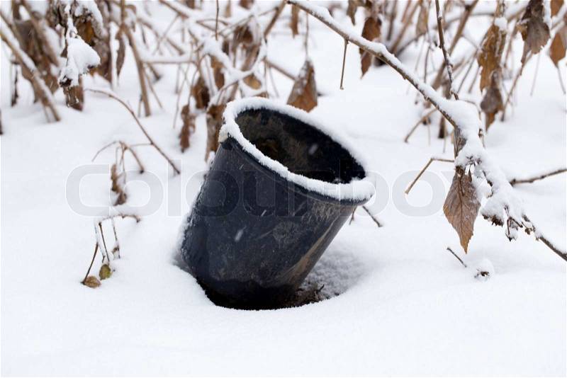 Bucket in the snow, stock photo
