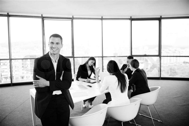 Group of happy young business people in a meeting at office, stock photo