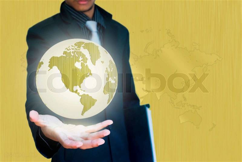 Gold world in hand business background, stock photo