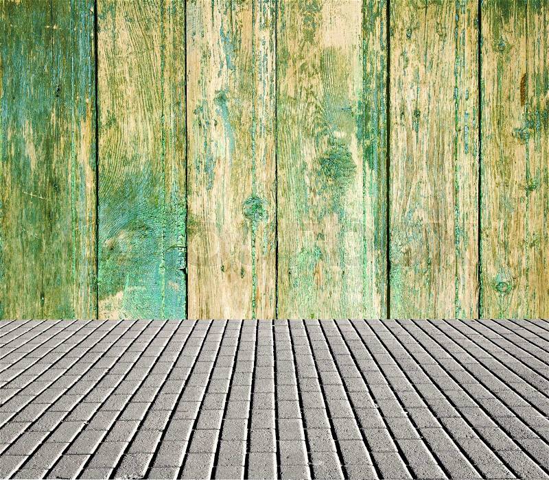Old interior with wooden wall and tiled floor, stock photo