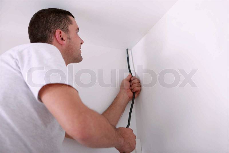 Craftsman fitting electricity, stock photo