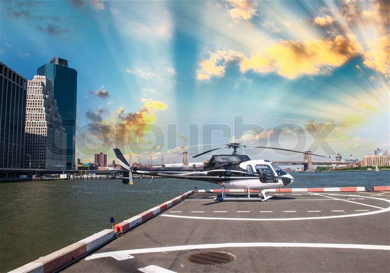 Helicopter on the launch platform in New York with city skyline, stock photo