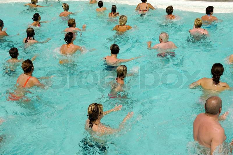 People are doing water aerobic in pool, stock photo