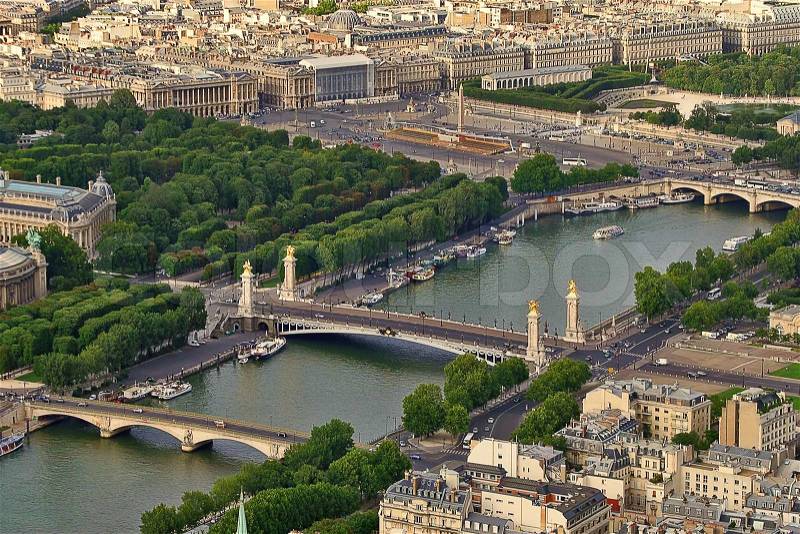 Aerial view of urban buildings and two bridges across Seine river in Paris, France (view from Eiffel Tower), stock photo