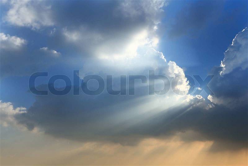 Sun break through the big white cloud and blue sky background, stock photo
