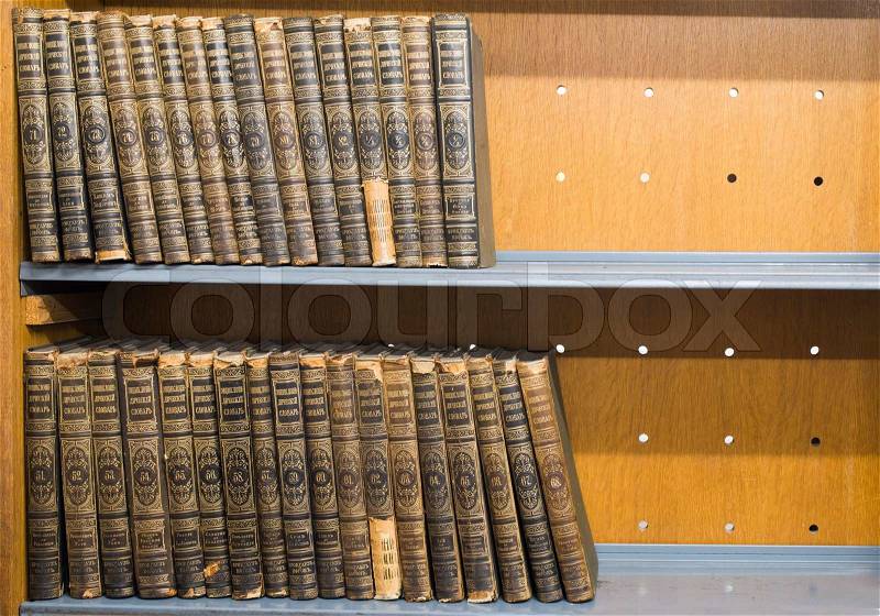 Old books on shelf. French encyclopedia, stock photo