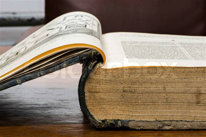 Open old big book. French encyclopedia, stock photo