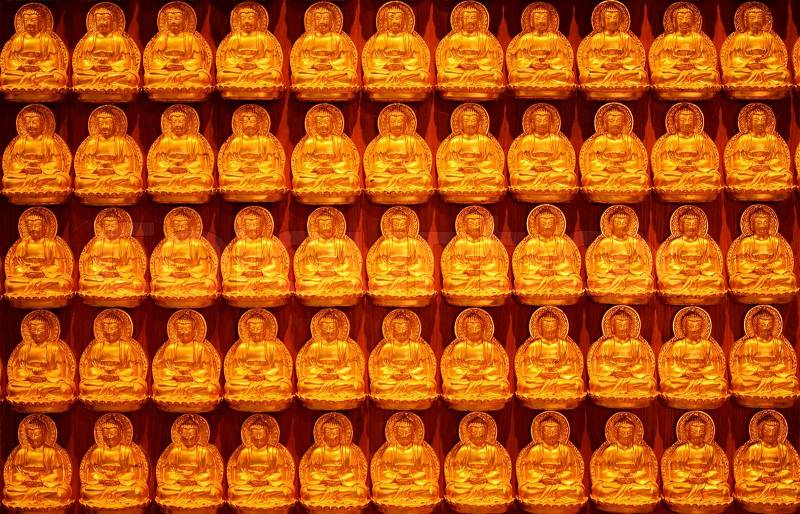 Buddha statue on the wall backgrond for Chinese new year, stock photo