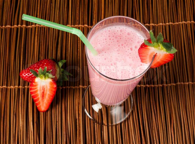 Strawberries milk shake and fresh fruit strawberry. Cocktail with milk, stock photo