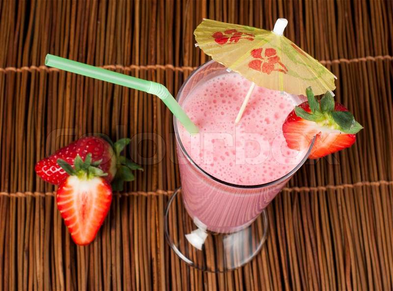 Strawberries milk shake and fresh fruit strawberry. Cocktail with milk, stock photo