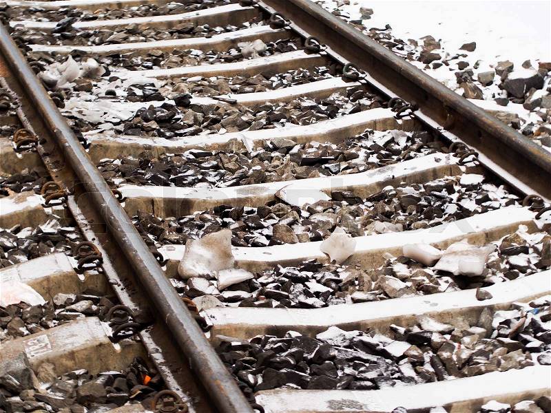 Railroad tracks in winter with snow, stock photo