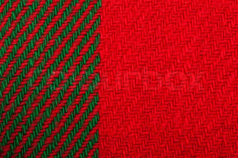 Handmade knit green and red background. Close up structure of the yarn. Christmas colors, stock photo
